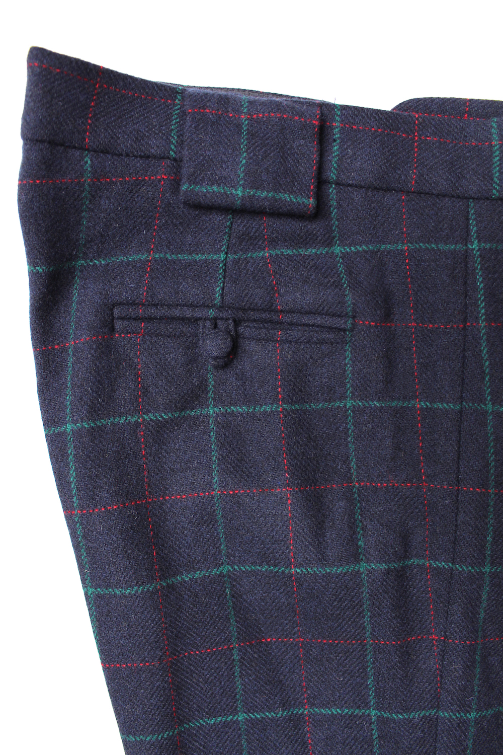 Navy blue, green and red over-check trousers with covered buttons ...